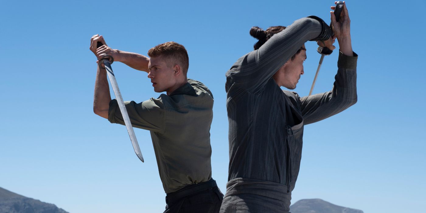 Josha Stradowski and Daniel Henney practicing swords in The Wheel of Time Season 3