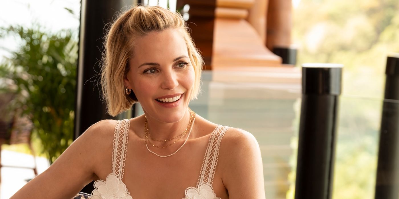 Leslie Bibb as Kate smiling at someone off-screen in The White Lotus Season 3, Episode 3.