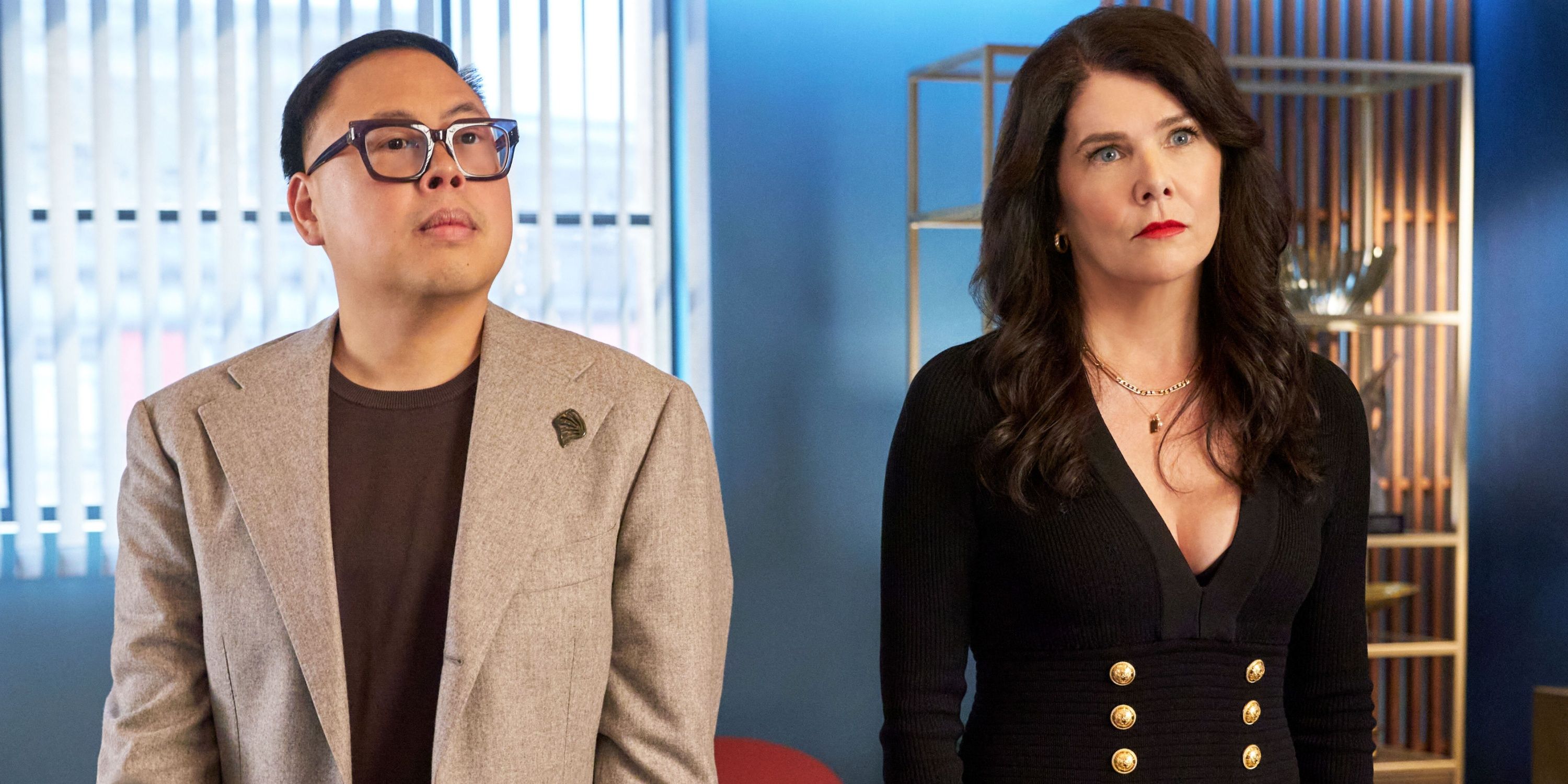 Lauren Graham as Monica in black standing next to Nico Santos as Doug in The Z-Suite