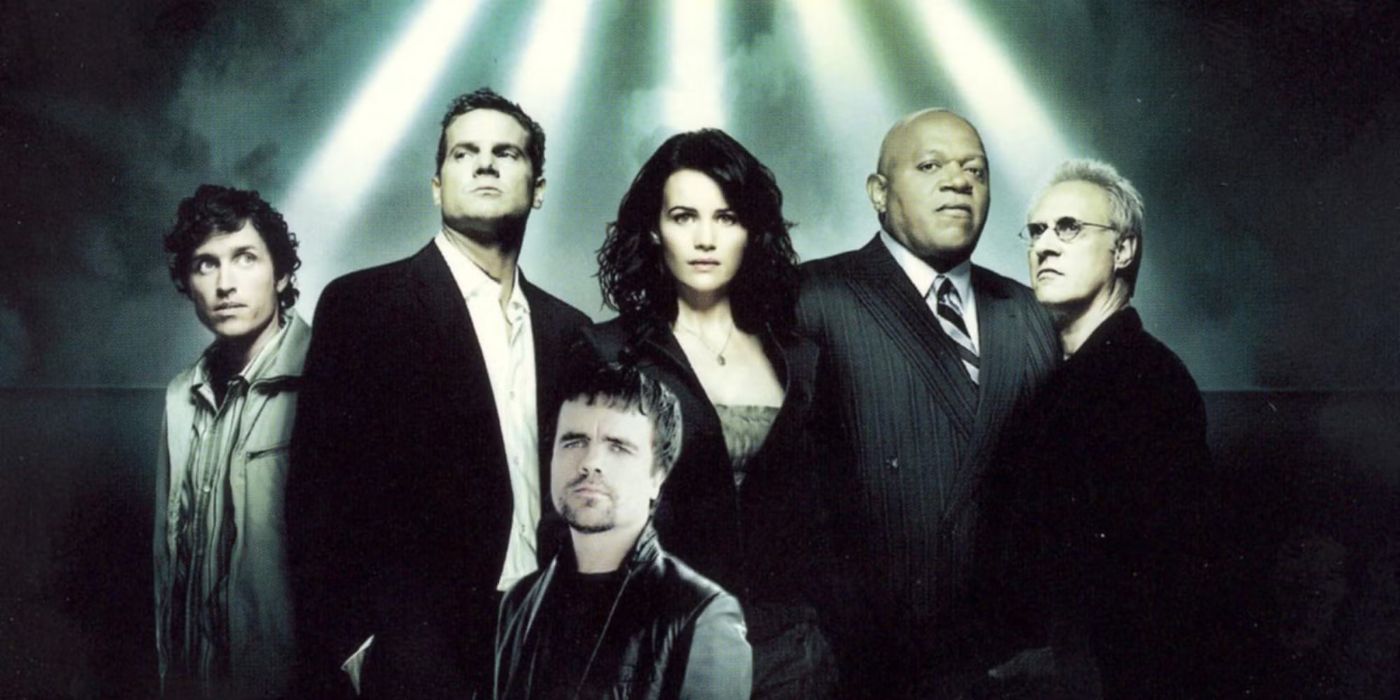 A promo image featuring the cast of the TV series Threshold in high contrast with beams of lights above.
