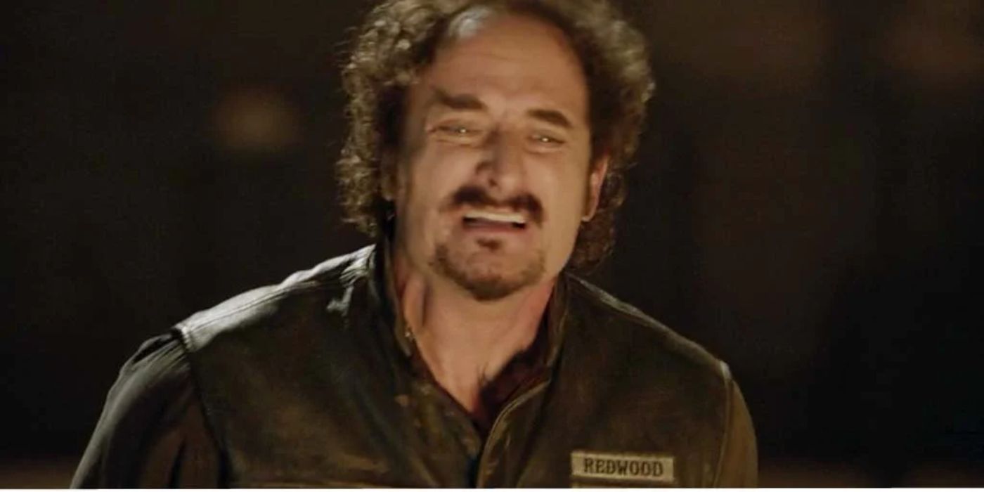 Kim Coates as Tig crying out in front of a fire in season 5, episode 1 of Sons of Anarchy.