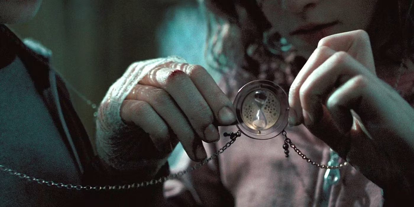 Hermione holds a necklace with an hourglass in the middle in Harry Potter and the Order of the Phoenix.