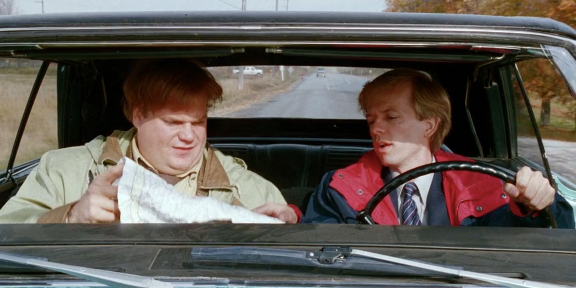 Tommy Callahan (Chris Farley) looks at a map while Richard Hayden (David Spade) points at it in &lsquo;Tommy Boy&rsquo;.