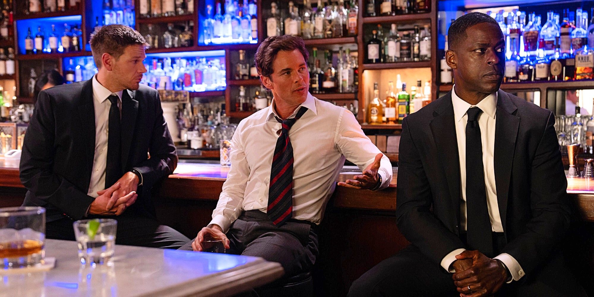Agent Billy Pace, President Cal Bradford, and Agent Xavier Collins sitting at a bar together in Paradise