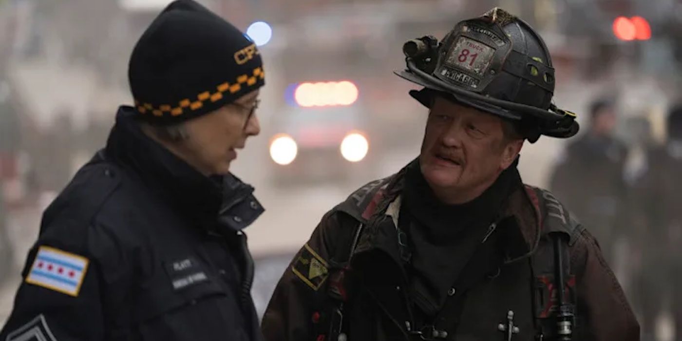 Mouch (Christian Stolte) and Trudy (Amy Morton) standing in the street in uniform in the One Chicago crossover "In the Trenches."