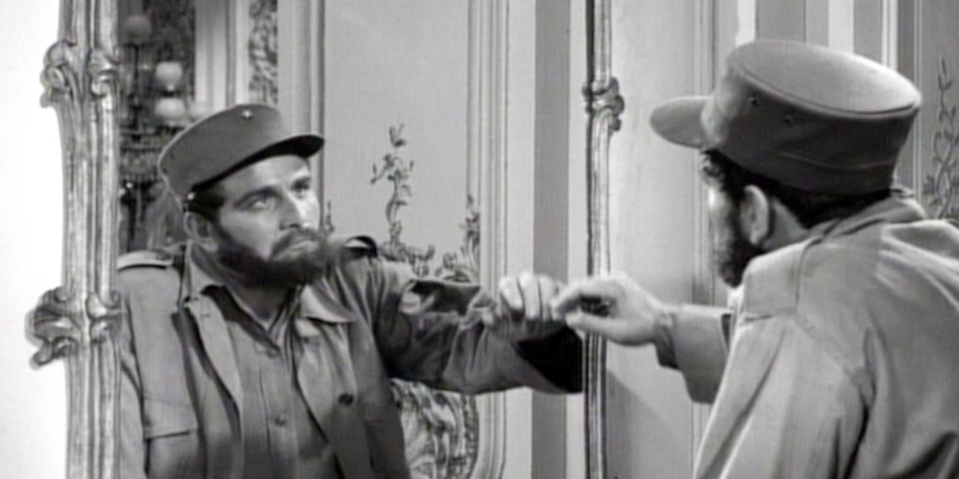 Peter Falk in a beard and uniform stares into a mirror in the Twilight Zone episode The Mirror.