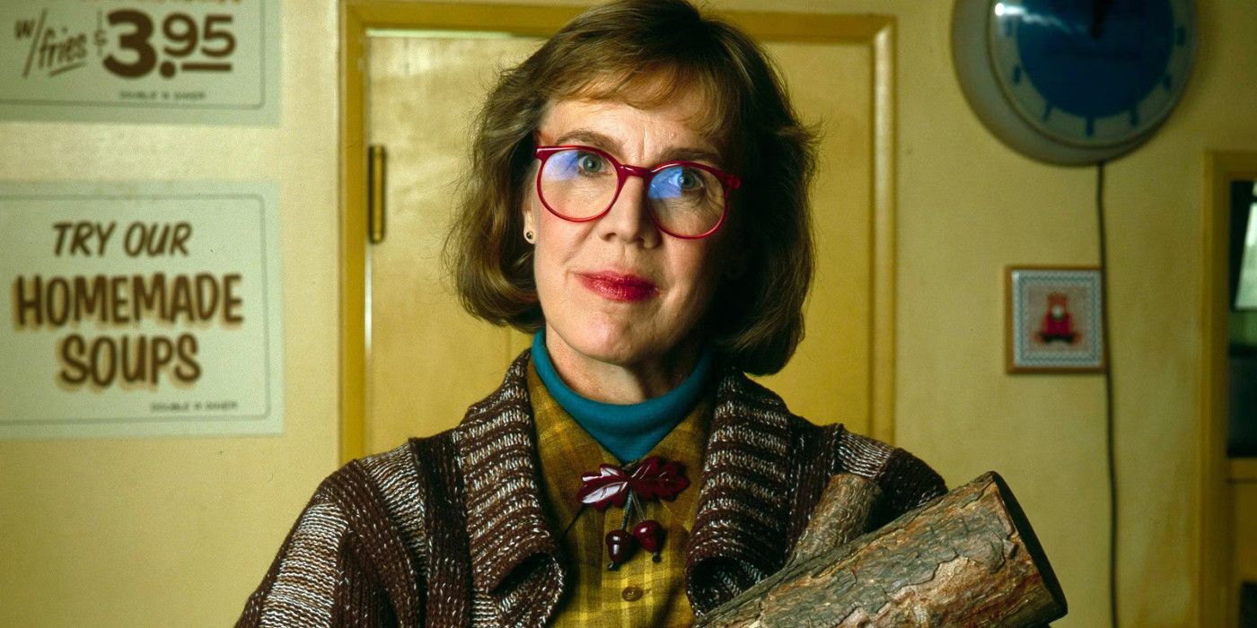 The Log Lady stands holding her log in Twin Peaks.