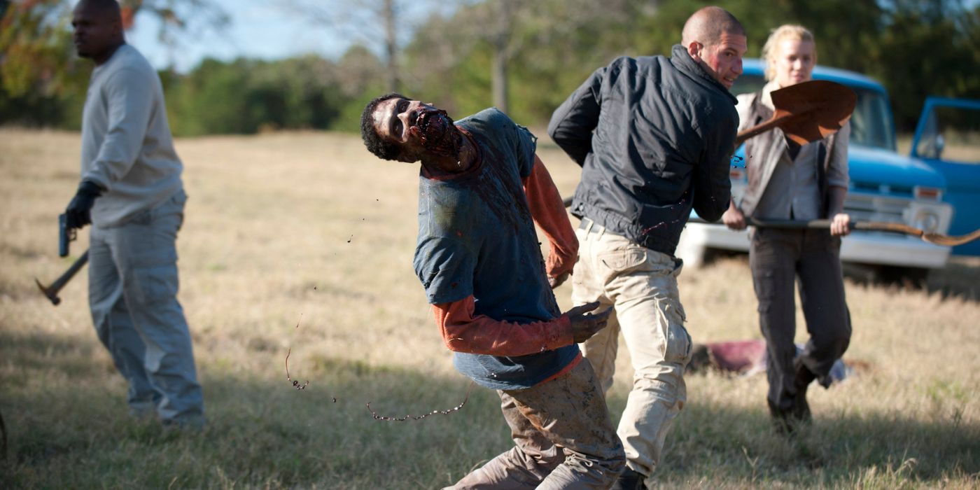 Jon Bernthal as Shane Walsh, attacking a zombie with a shovel in The Walking Dead.