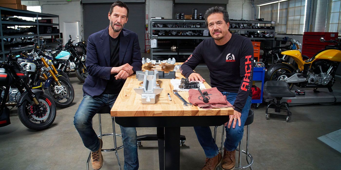 Keanu Reeves and ARCH co-founder Gard Hollinger in their shop sitting at a table