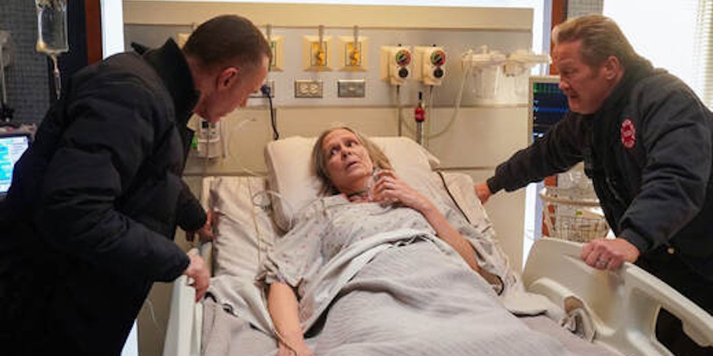 Voight (Jason Beghe) and Mouch (Christian Stolte) get information from Trudy (Amy Morton) in the One Chicago crossover "In the Trenches."