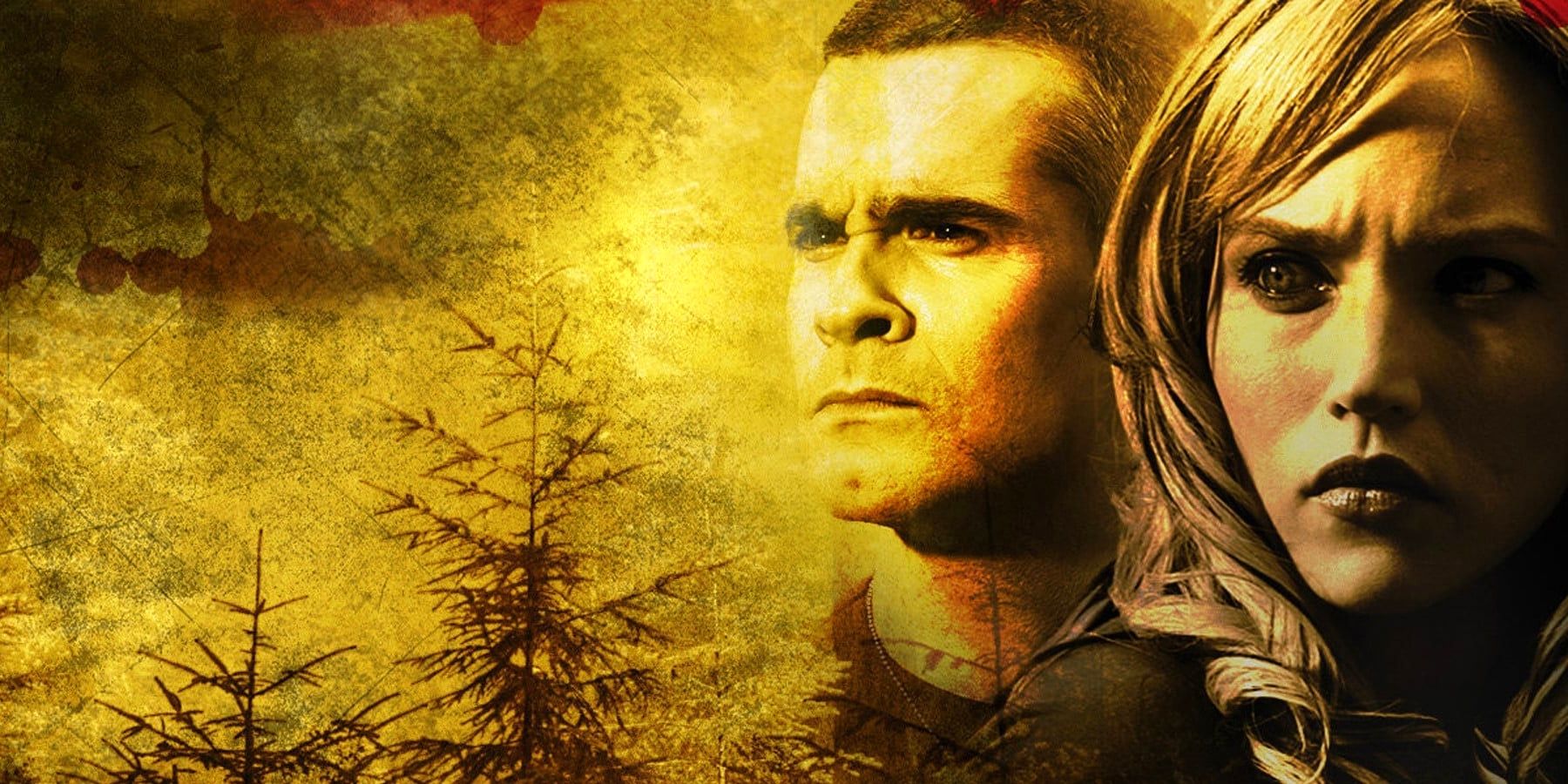 Henry Rollins and Erica Leerhsen as Dale and Nina, looking out worriedly over a yellowish forest landscape in Wrong Turn 2: Dead End.