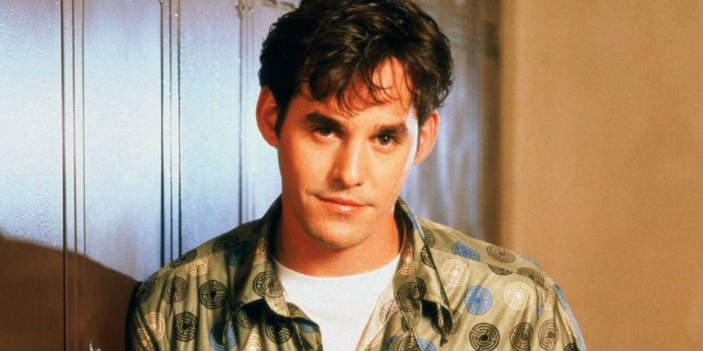 Nicholas Brendon as Xander Harris looking at the camera and smiling slightly in Buffy the Vampire Slayer.