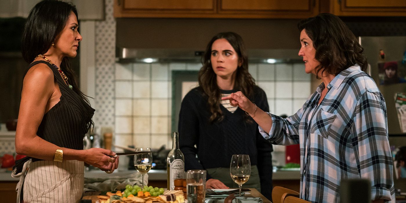 Shauna angrily pointing at Lottie in the kitchen in front of Callie in Yellowjackets Season 3