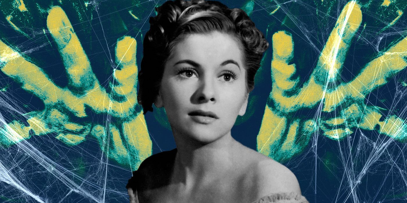 Betsy Connell, played by actor Frances Dee, looking demure against a blue background of spiderwebs and large ghostly hands.