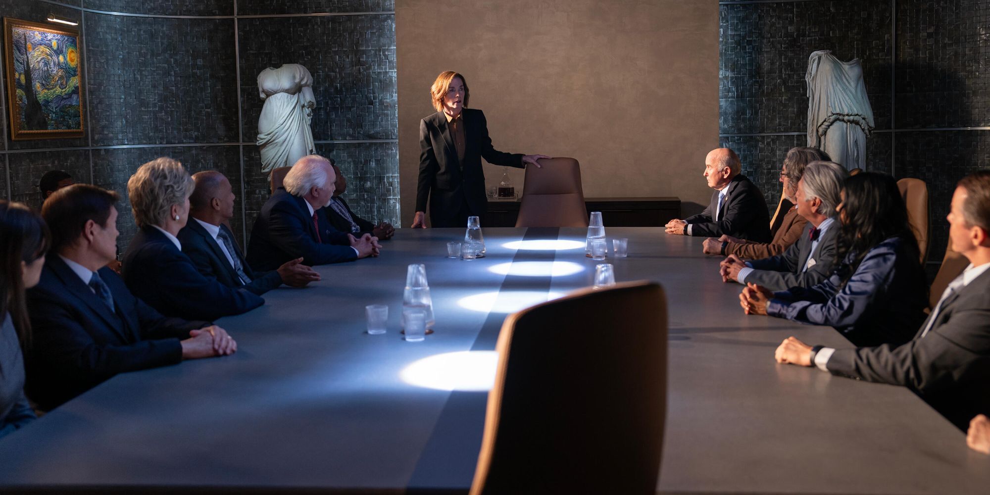 Sinatra at the head of a table with men in suits in Paradise