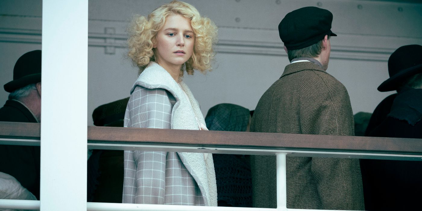 Julia Schlaepfer as Alex Dutton looking over the rail of a ship in 1923 Season 2 Episode 3.