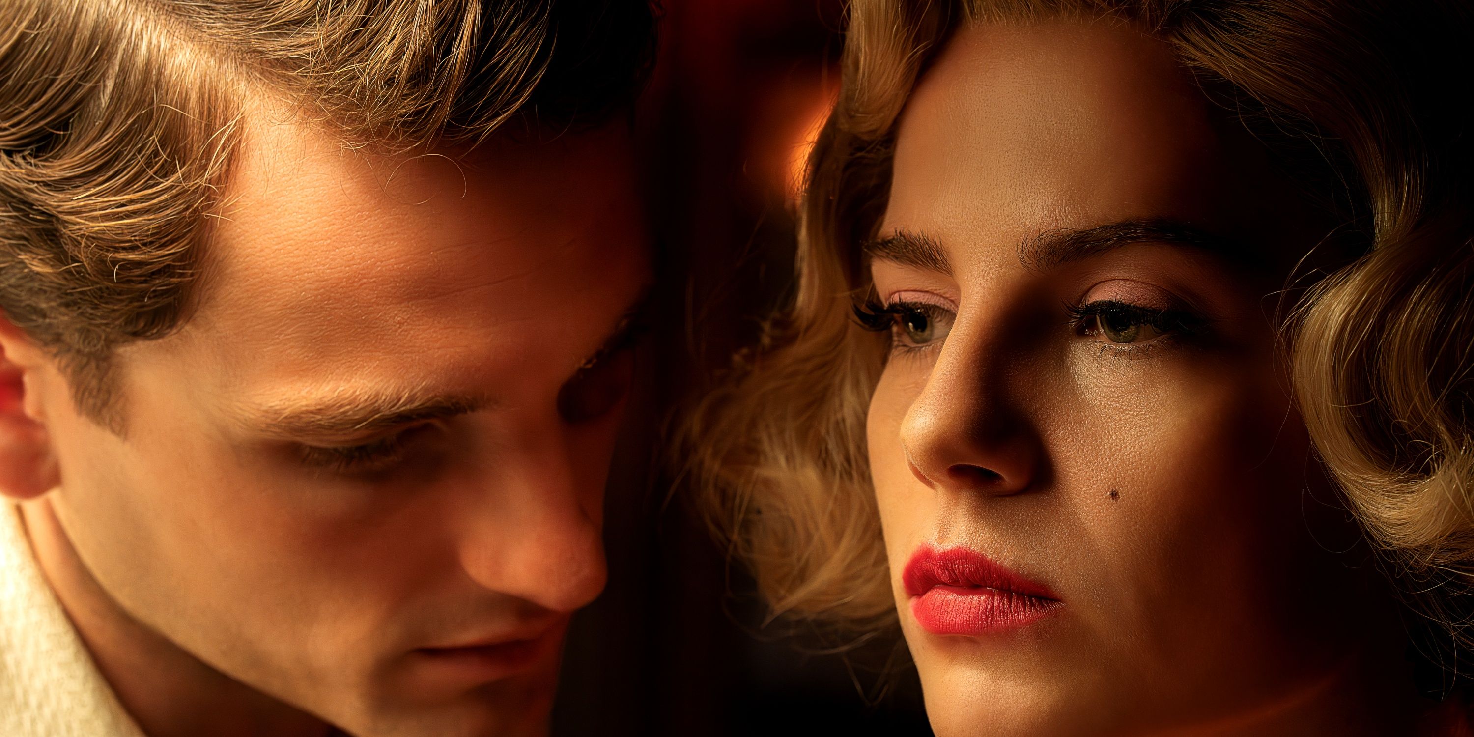 Lucy Boynton as Ruth and Laurie Davidson as David next to her right cheek in A Cruel Love: The Ruth Ellis Story