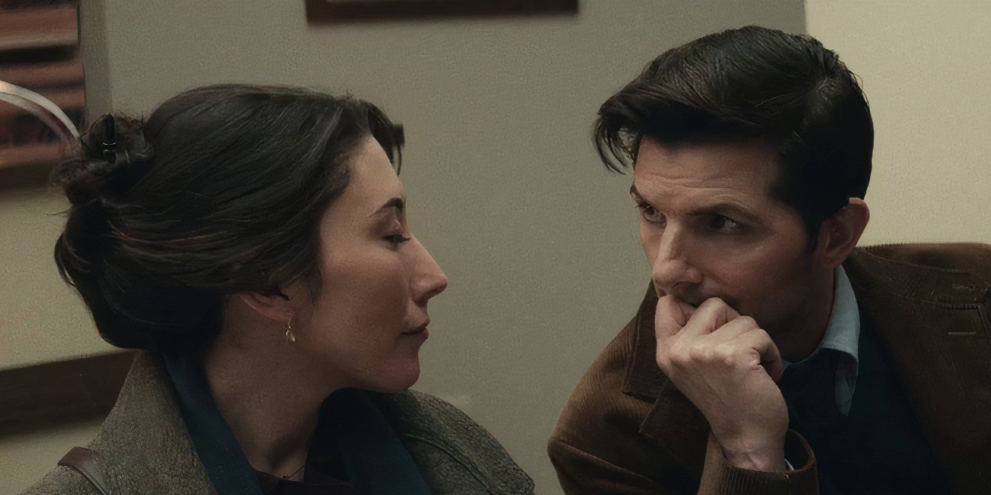 Adam Scott and Dichen Lachman as Gemma and Mark in Severance looking at each other