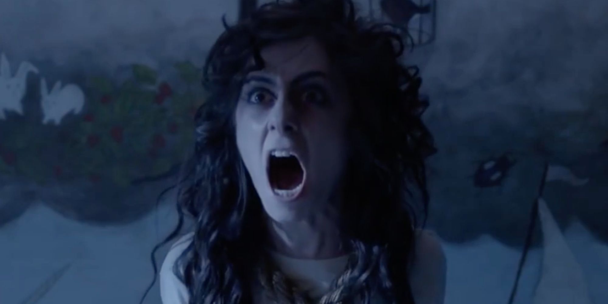 Aimy, played by actress Allisyn Snyder, screaming in the darkness in Aimy in a Cage.