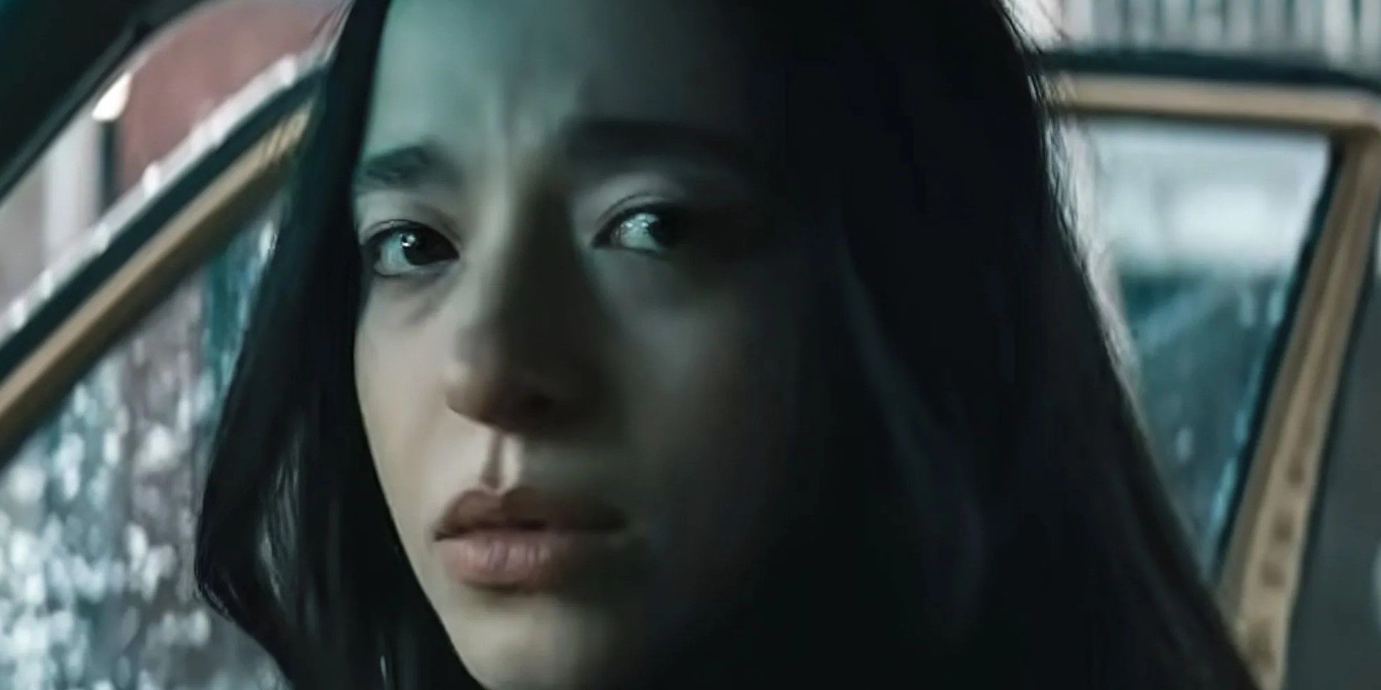 Anora looking at the camera with a sad expression in Anora