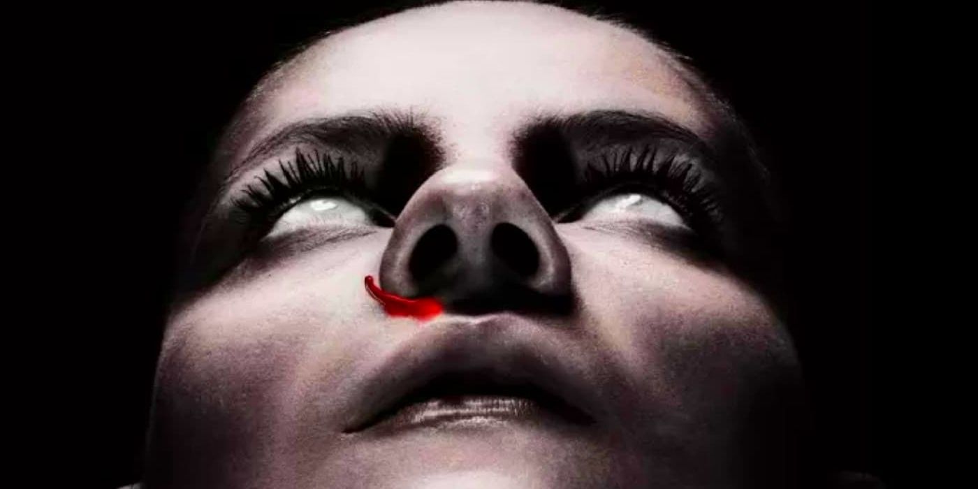 The face of a young dead woman with milky eyes and blood trailing from her nose in The Autopsy of Jane Doe.