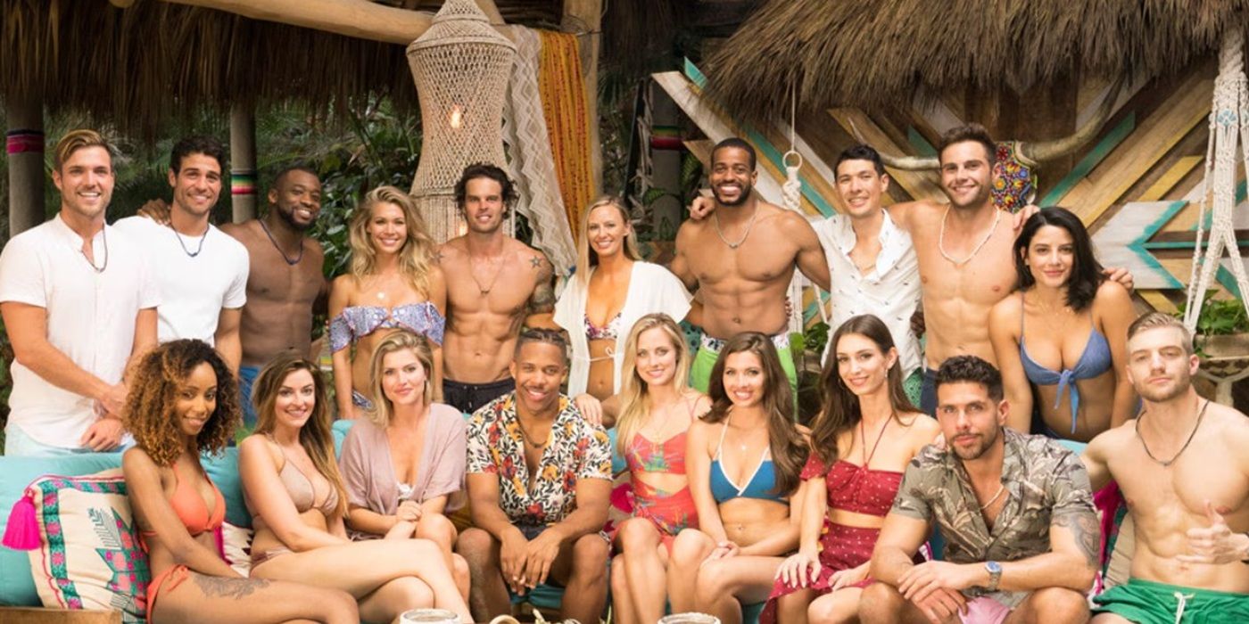 &lsquo;Bachelor in Paradise&rsquo; cast pose for a photo in swimsuits in front of a tropical setting.