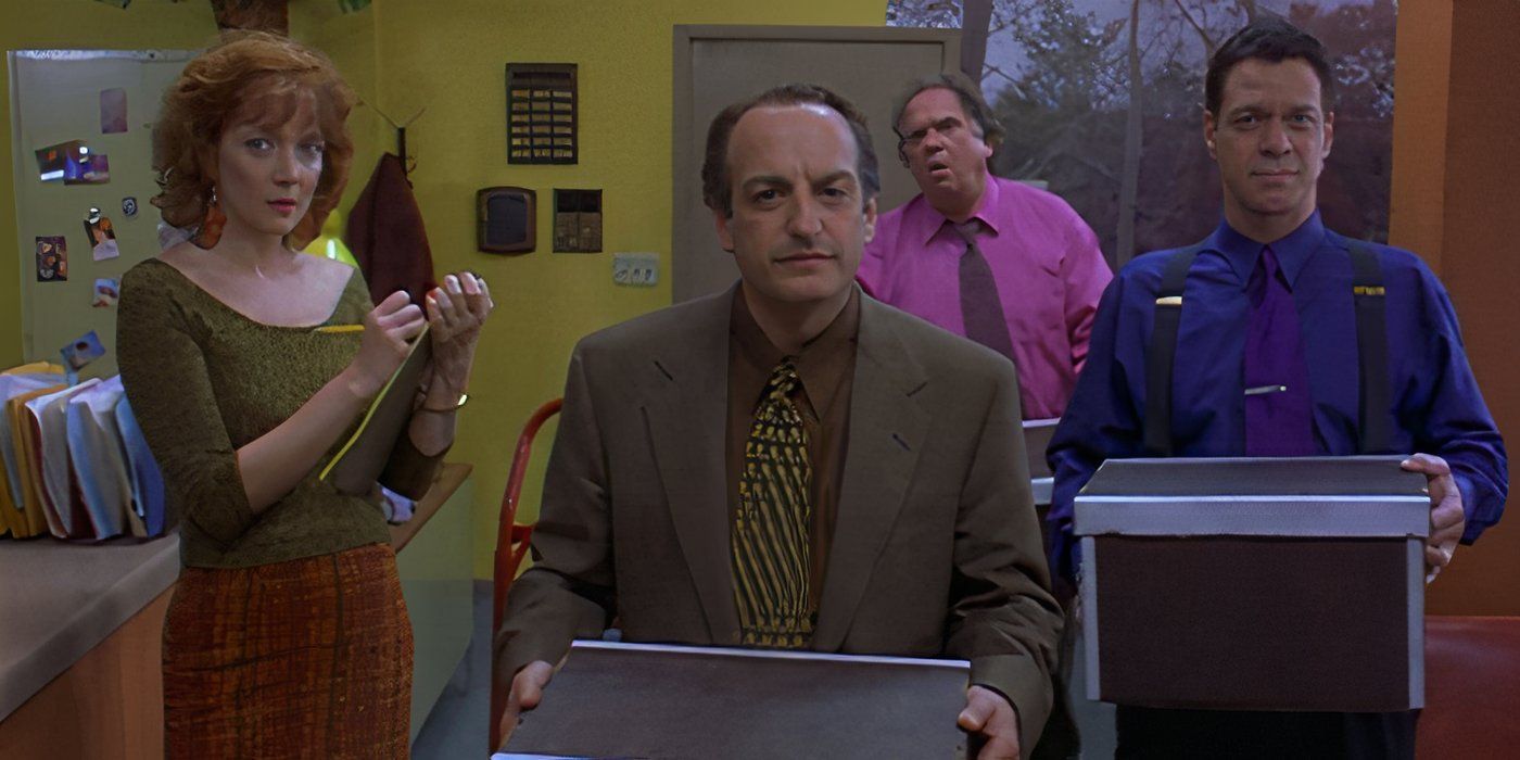 Glenne Headly as Vivian, David Paymer as the Boss, Maury Chaykin as Earnest, and Joe Piscopo as Rocky holding TVs and staring confusedly in Bartleby (2001).