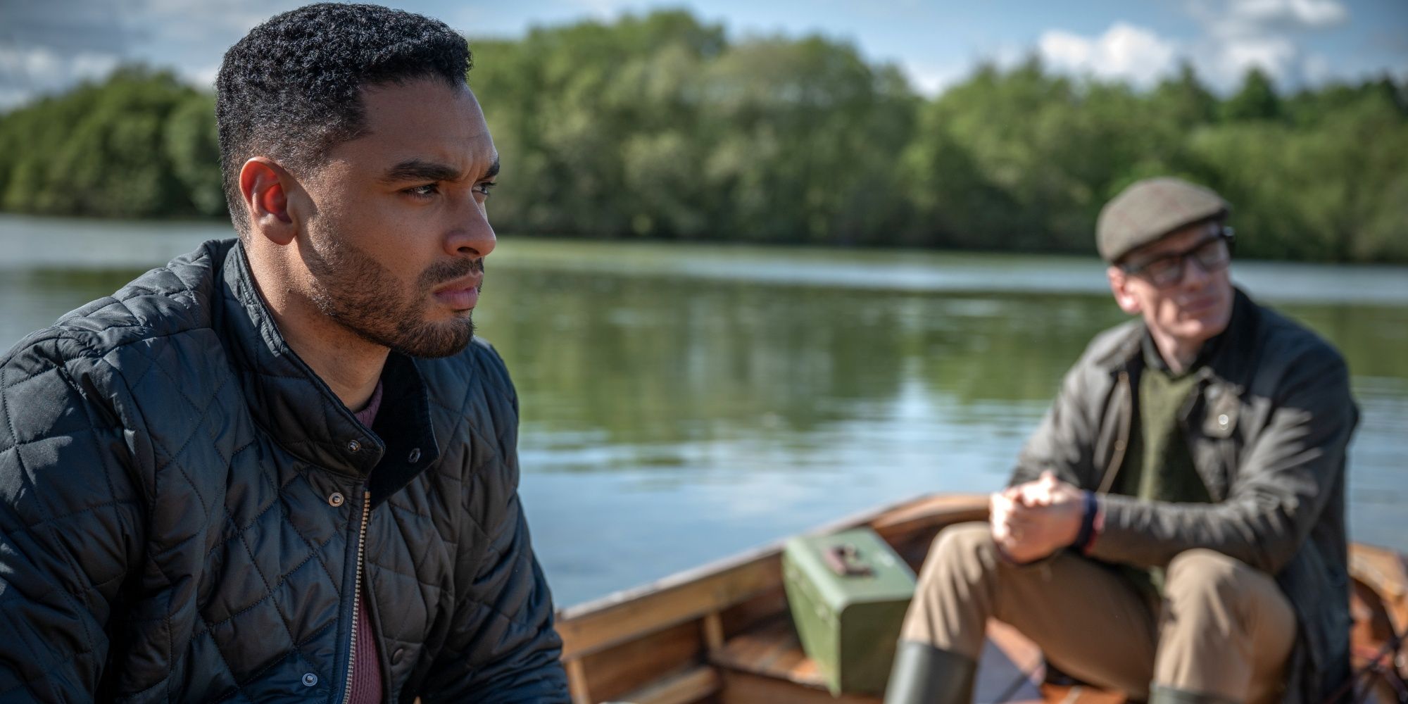 Michael Fassbender as George Woodhouse and Regé-Jean Page as Colonel James Stokes in a boat in Black Bag