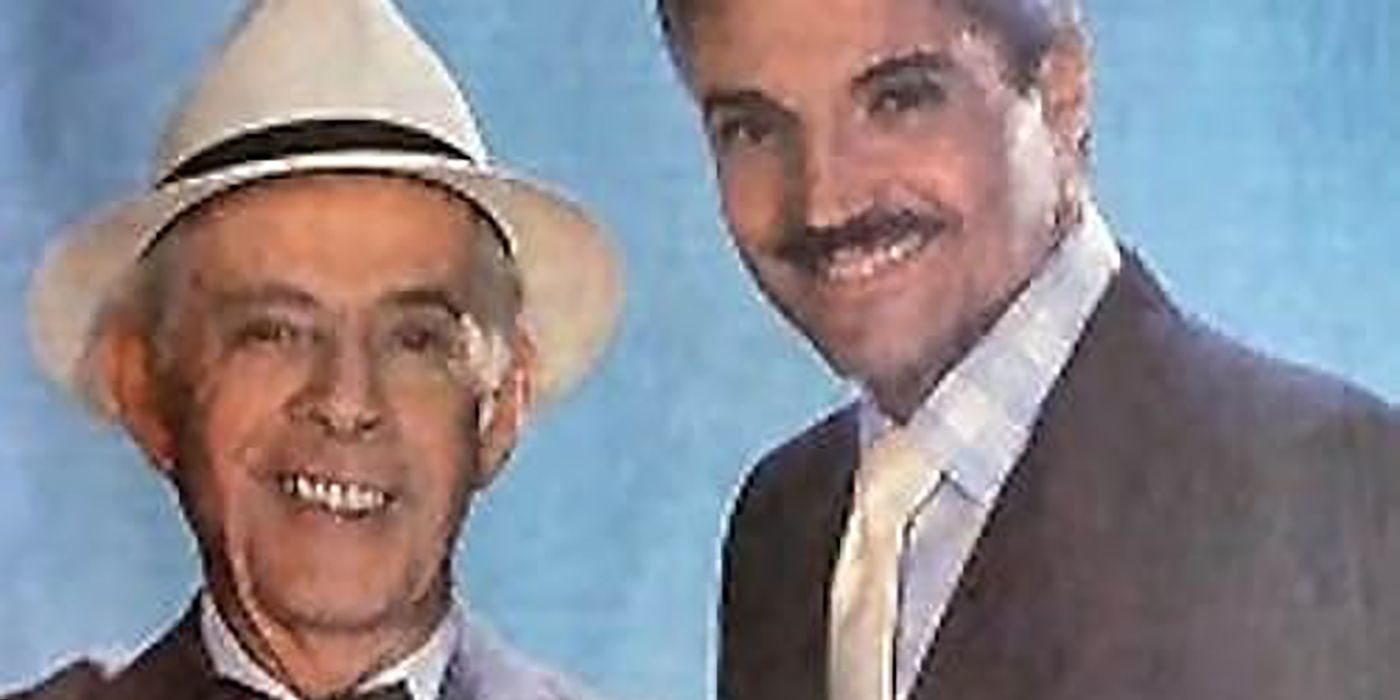 Two men in suits, one wearing a hat, in Blacke&rsquo;s Magic.