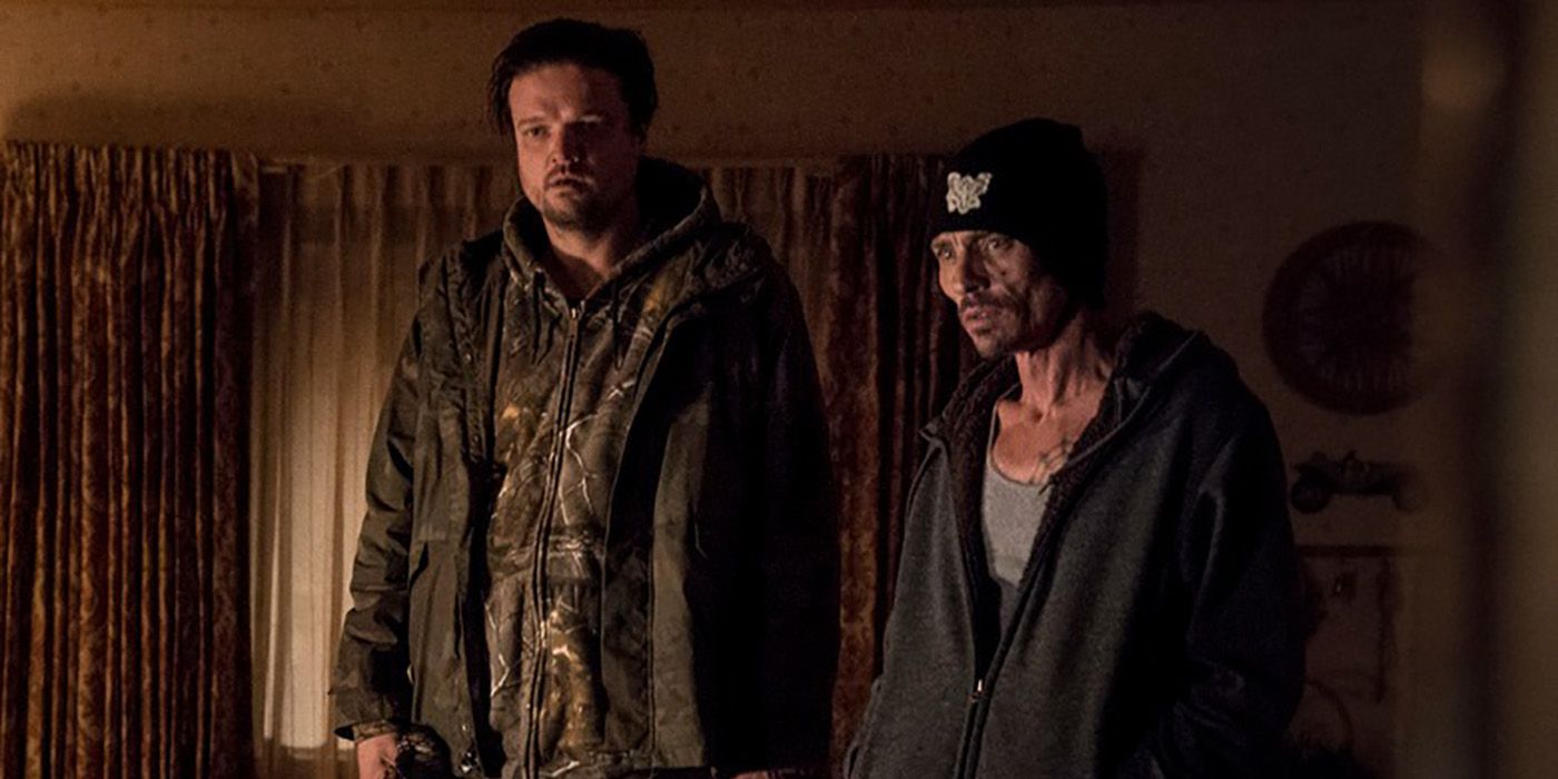 Badger and Skinny Pete looking stunned in the living room in Breaking Bad.