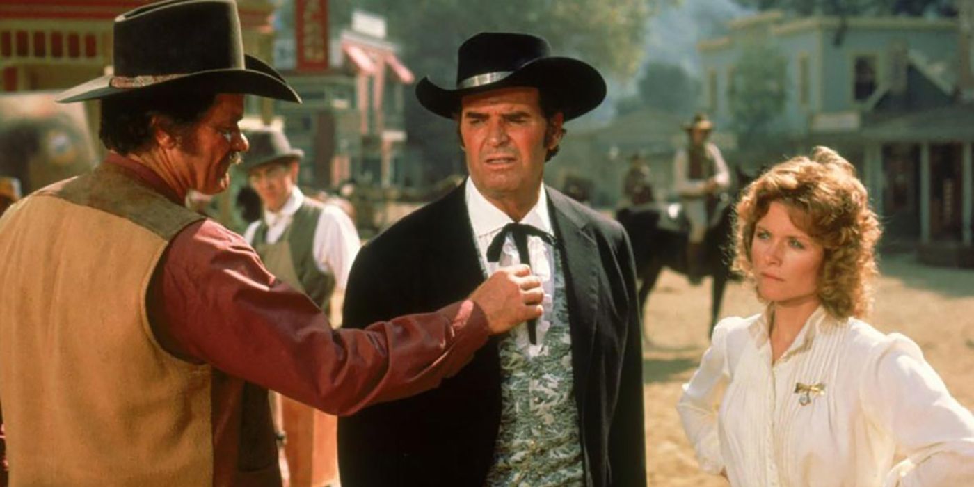 Two men in cowboy hats talking to a woman in Bret Maverick.