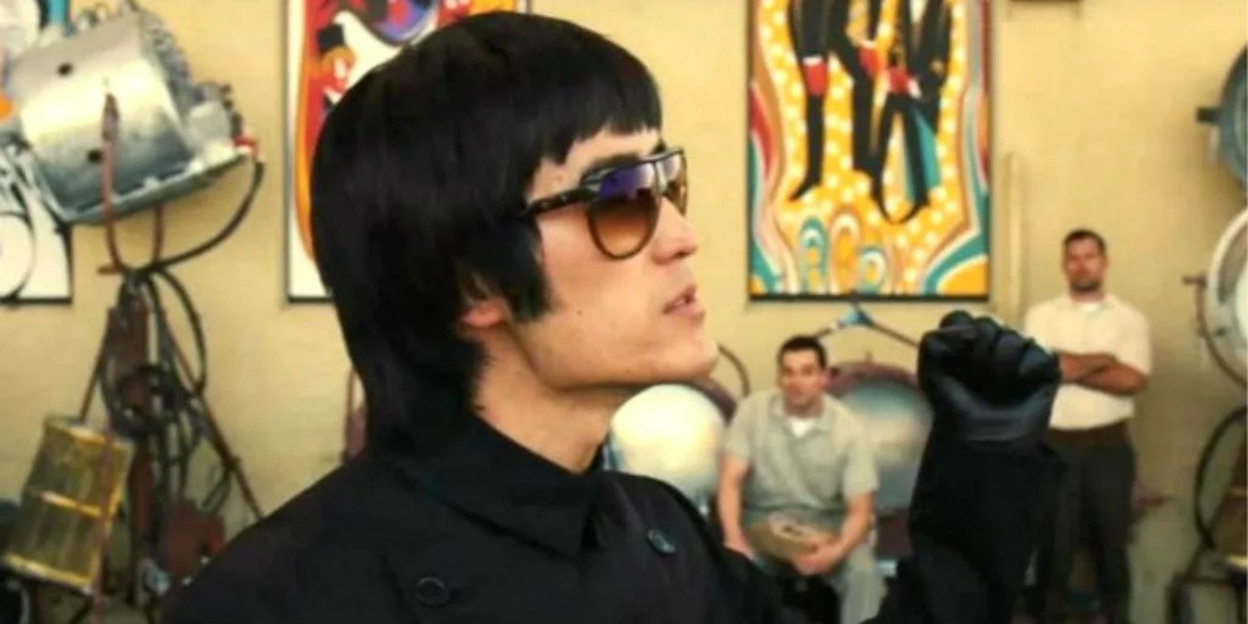 Mike Moh as Bruce Lee holding up his fist in Once Upon a Time&hellip; in Hollywood.