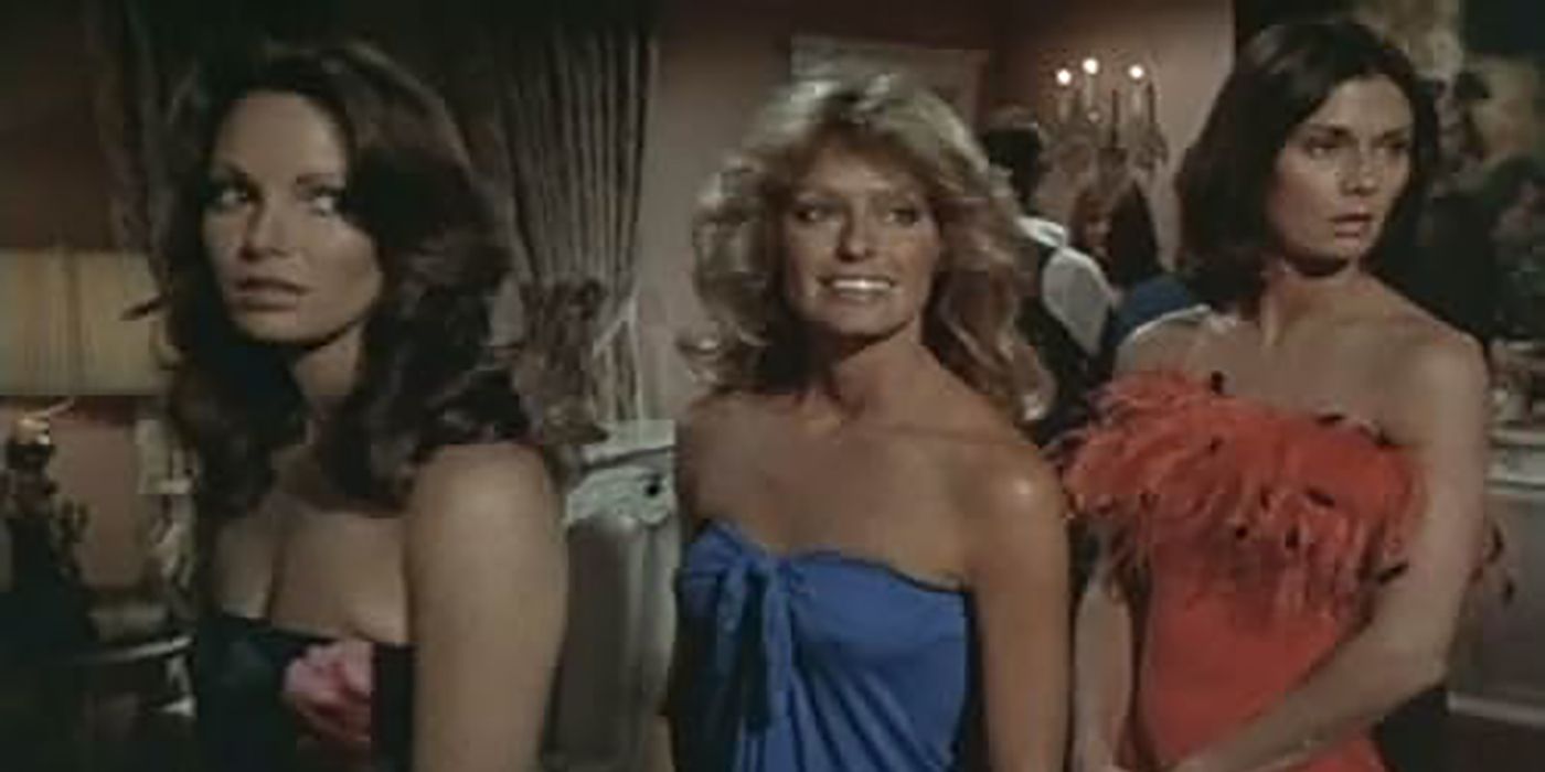 Three women in dresses smiling in Charlie&rsquo;s Angels.