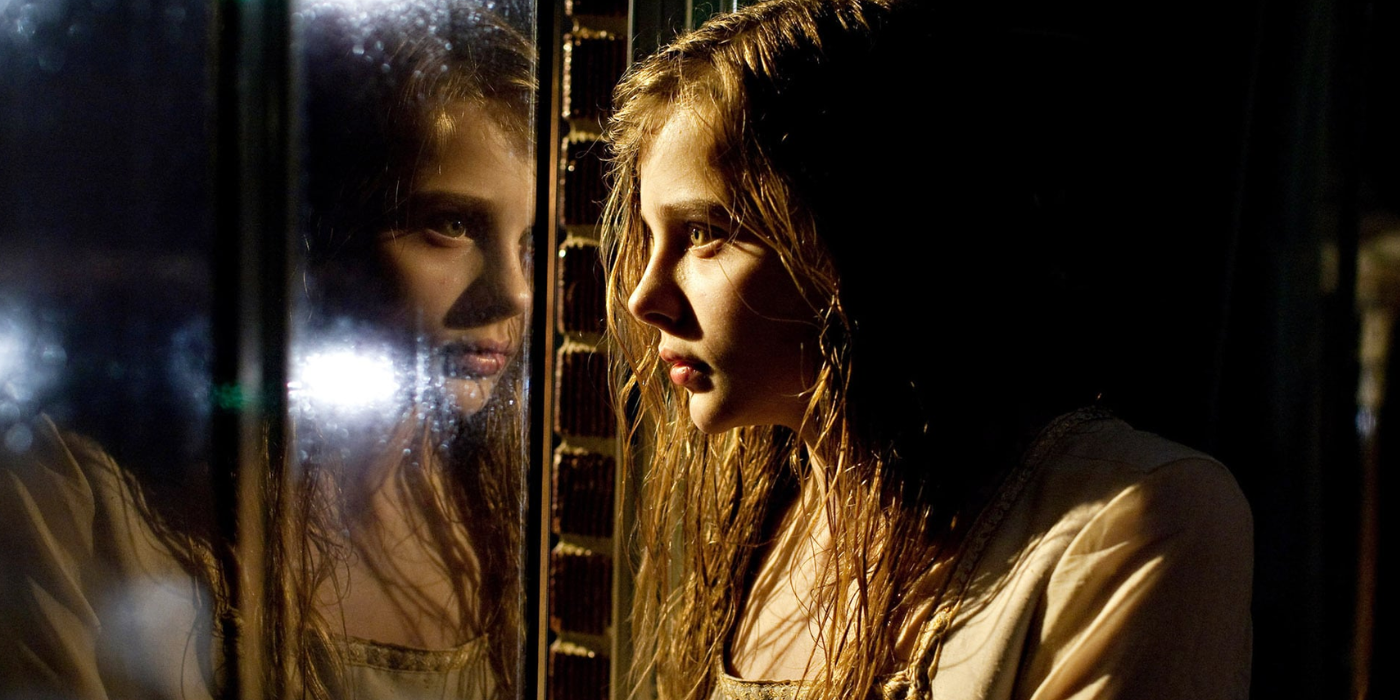 Chloe Grace Moretz stares out the window in Let Me In