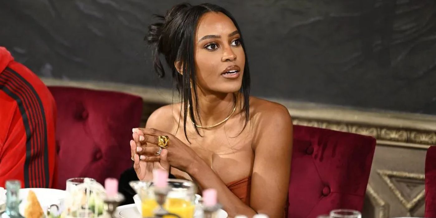 Ciara Miller talking to someone to her left, off-screen, on The Traitors Season 3.