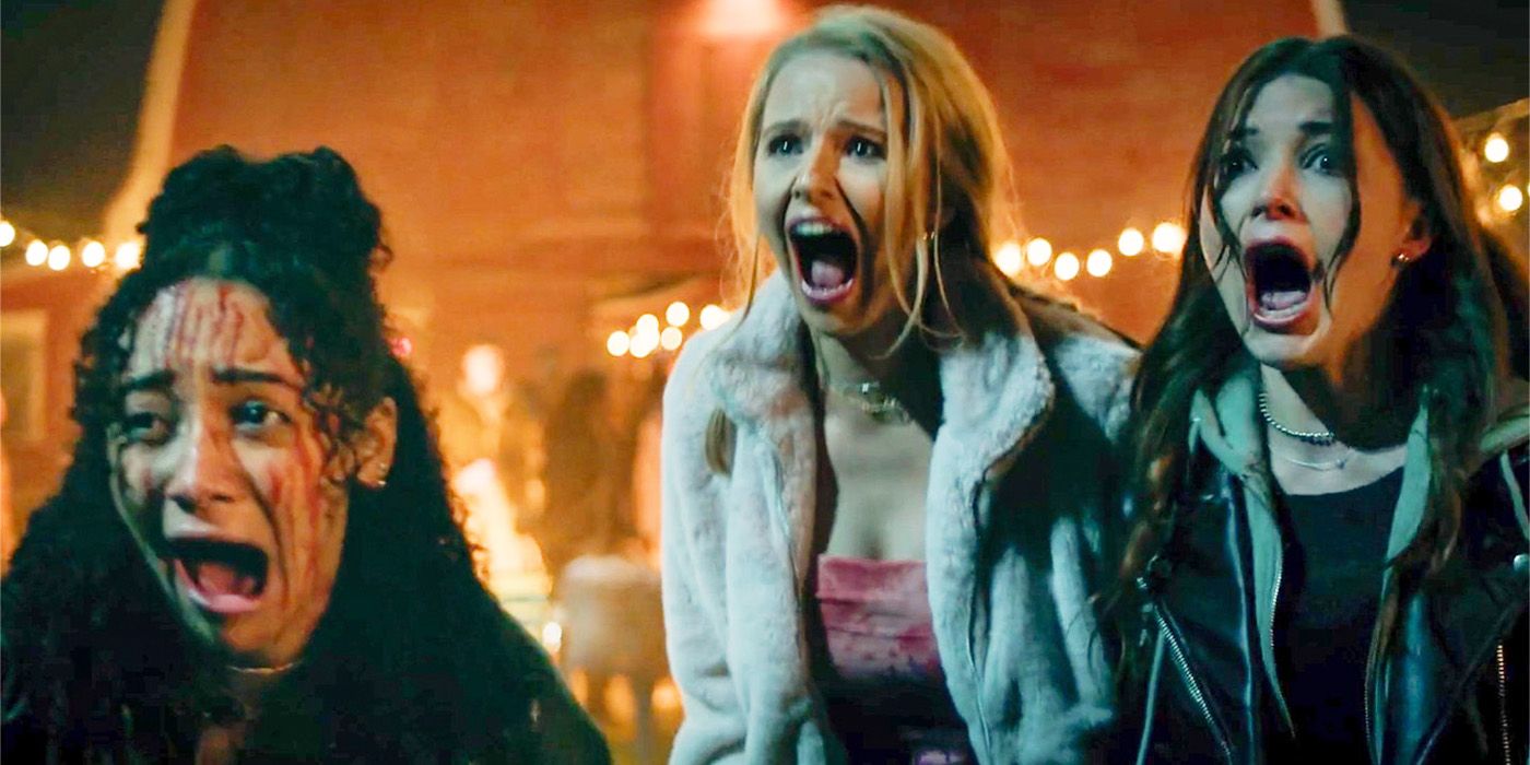 Verity Marks, Cassandra Potenza and Katie Douglas screaming in terror at a carnival