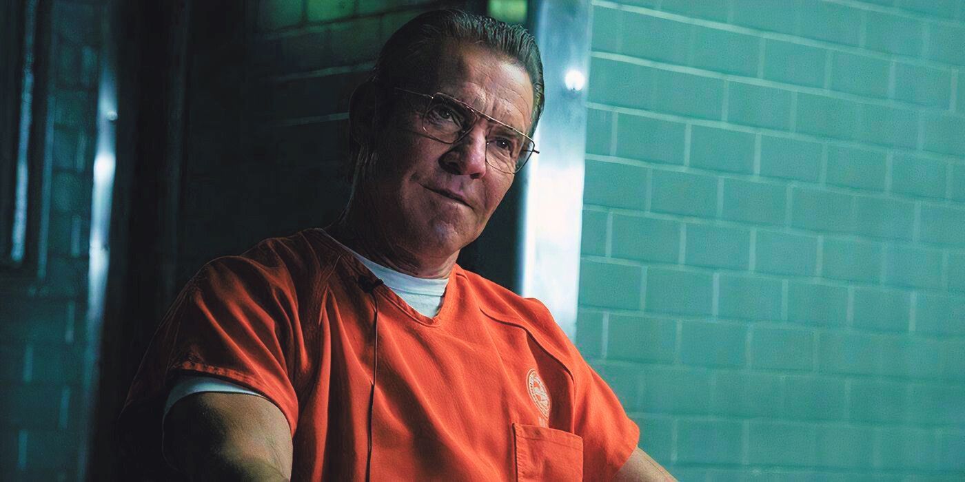 Dennis Quaid wearing glasses and an orange jumpsuit in Happy Face.