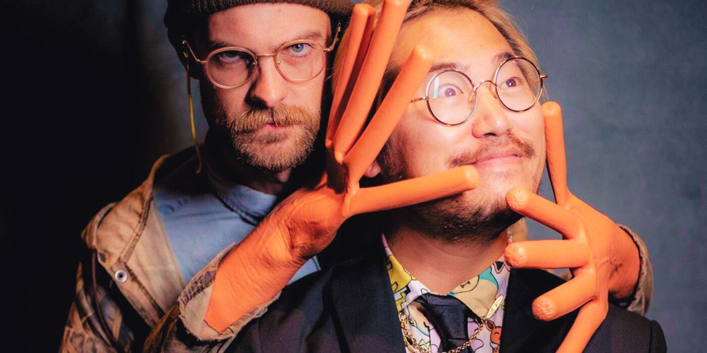 The Daniels: Daniel Kwan and Daniel Scheinert posing together with hotdog hands