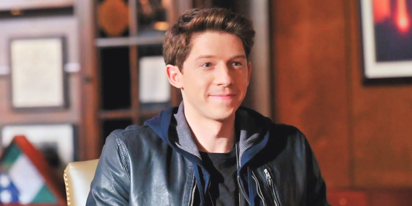 Will Hochman as Joe Hill, sitting and smiling, wearing a leather jacket on Blue Bloods