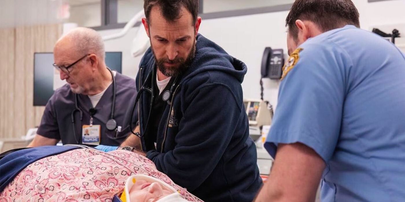 Dr. Robby and medical team lean over a woman on a gurney in &lsquo;The Pitt&rsquo;
