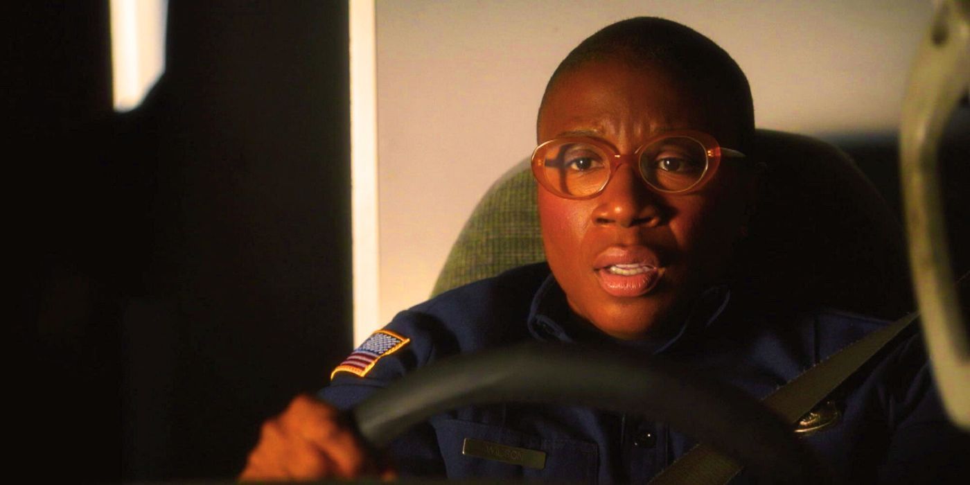 9-1-1 Hen sits behind the wheel of an ambulance