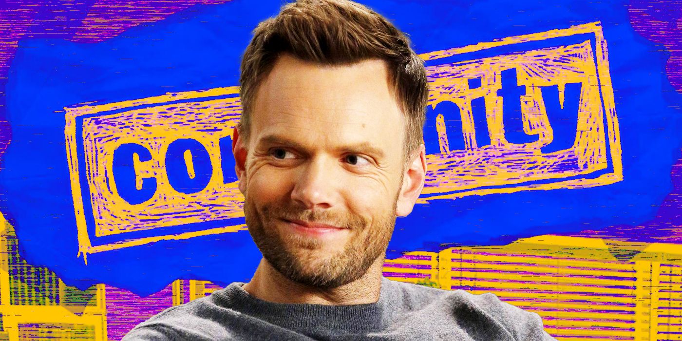 Joel McHale as Jeff Winger is all smiles while sitting in the foreground of Community TV signage.