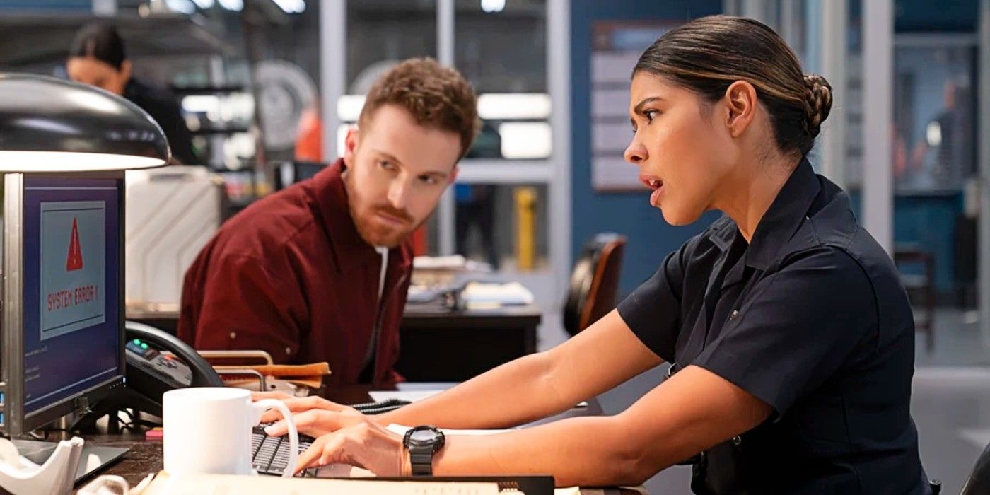 Rodge watching as Celina Juarez searches her computer in The Rookie Season 7
