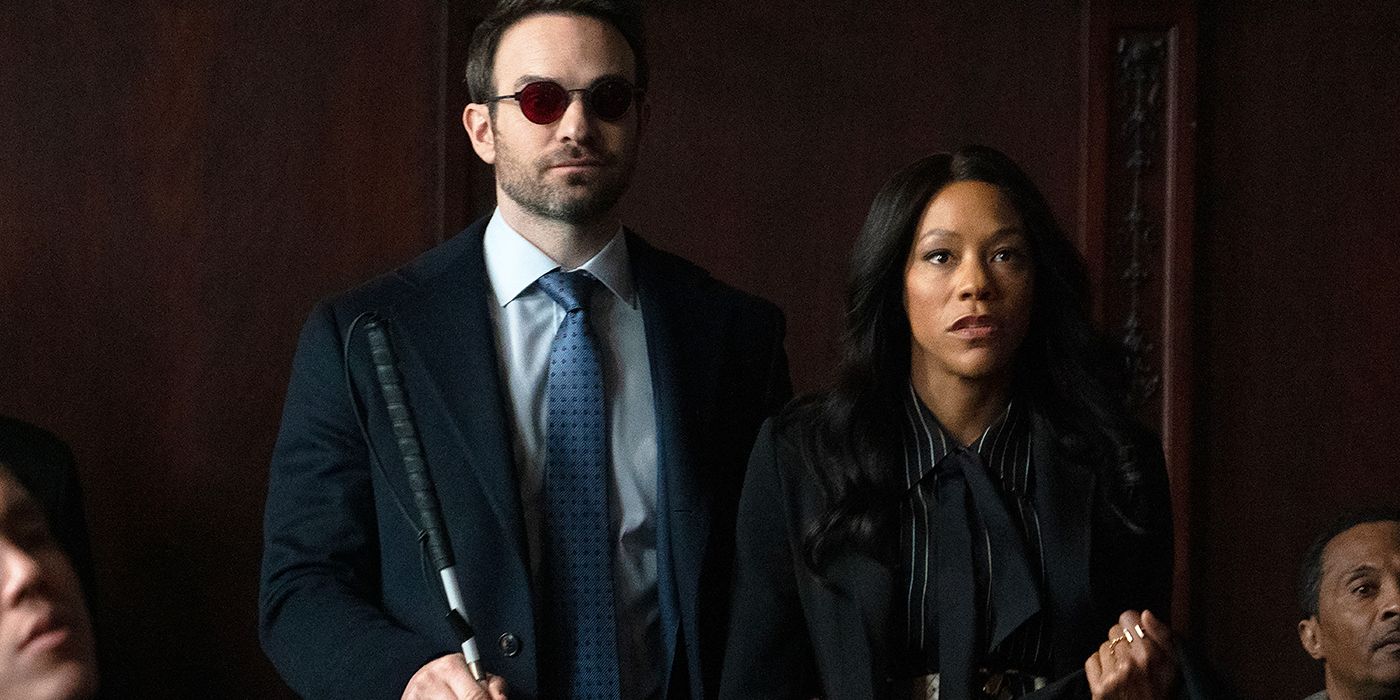 Charlie Cox as Matt Murdock standing next to Nikki M. James as Kirsten McDuffie standing in court together in Daredevil: Born Again