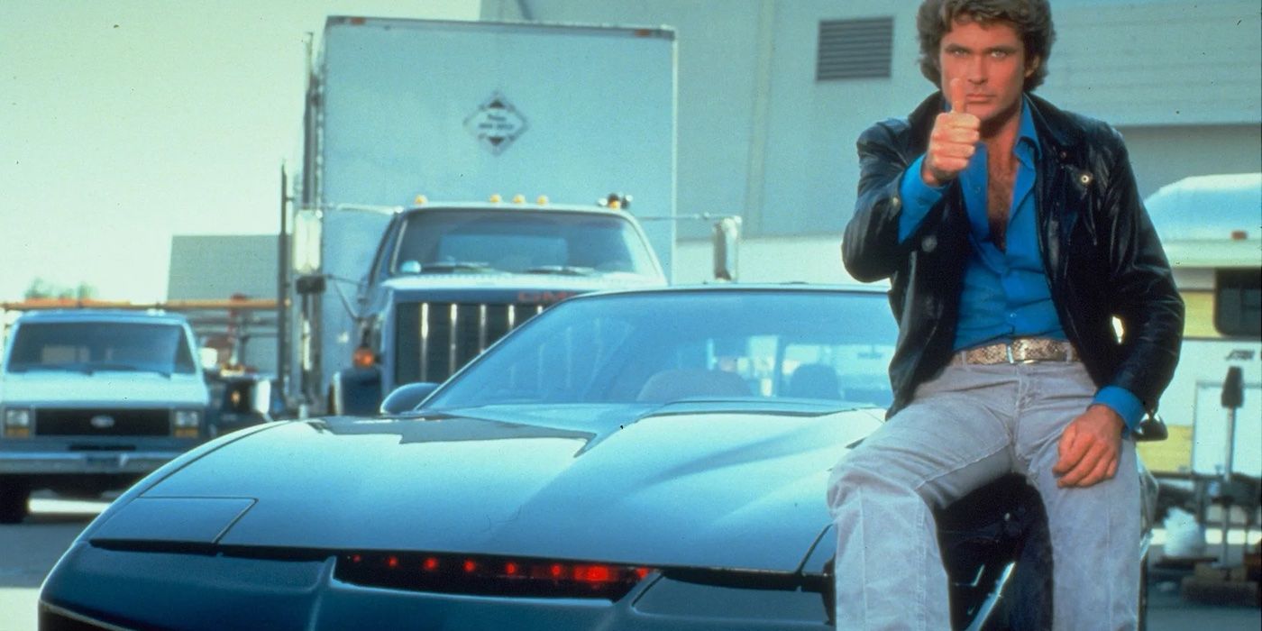 David Hasselhoff gives a thumbs up while sitting on KITT on the set of Knight Rider.