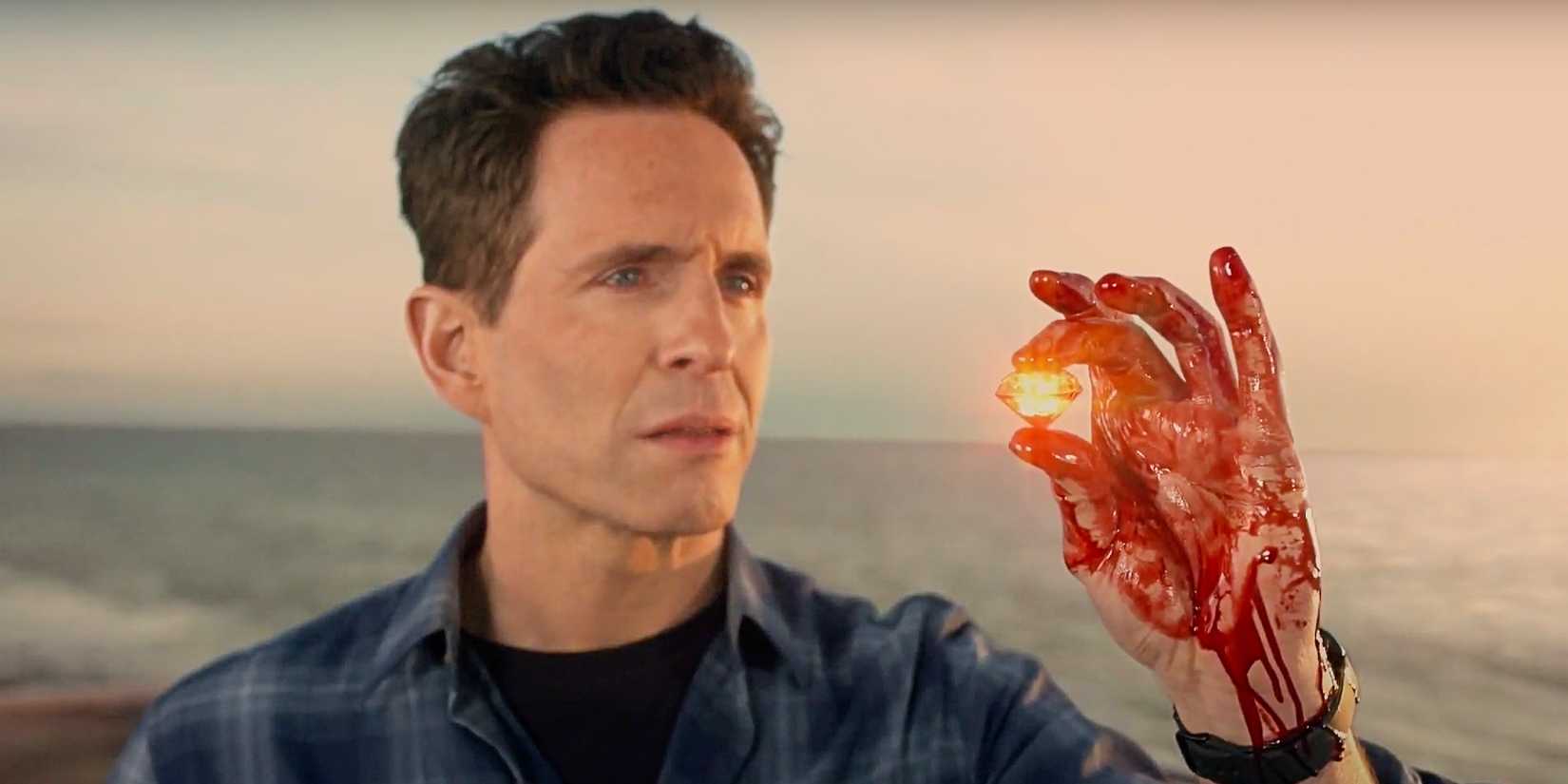 Dennis Reynolds holding a glowing diamond in his bloody hand in It's Always Sunny in Philadelphia Season 16