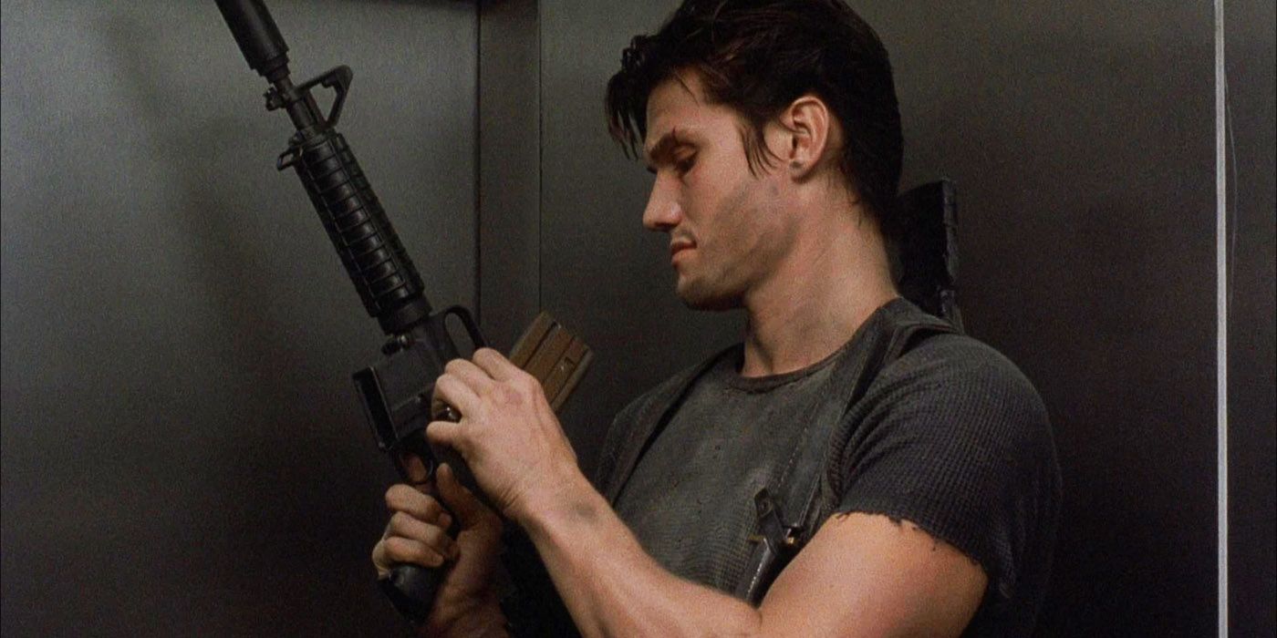 Dolph Lundgren as Frank Castle loading up an M-16 in The Punisher.