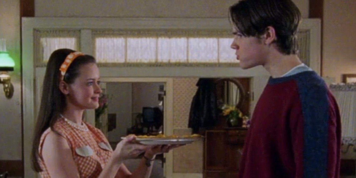 Rory Gilmore as Donna Reed serving cookies to Dean Forrester in Gilmore Girls.