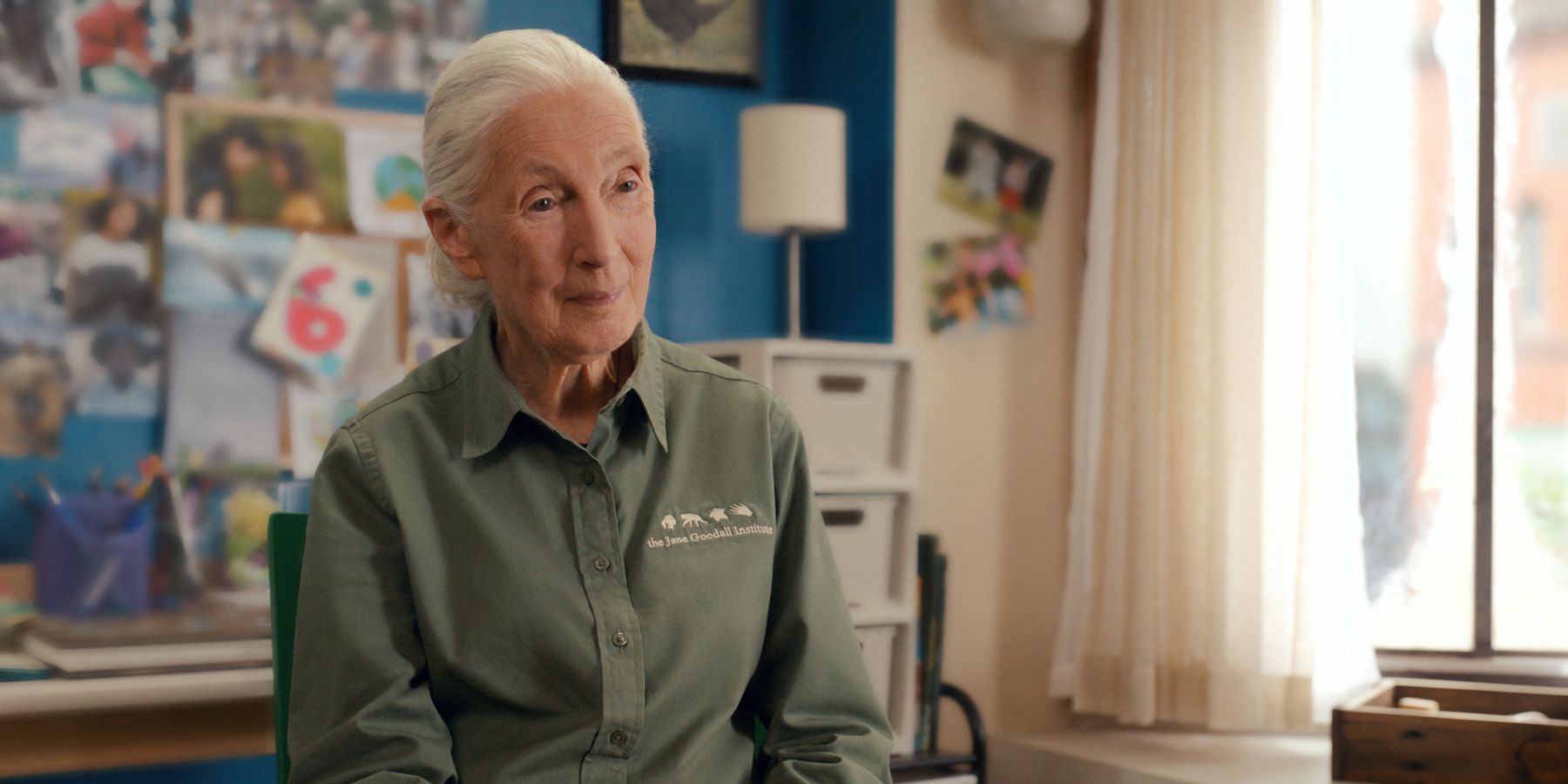 Dr Jane Goodall sat on a chair in her uniform on Apple TV+&rsquo;s &lsquo;Jane&rsquo; Season 3
