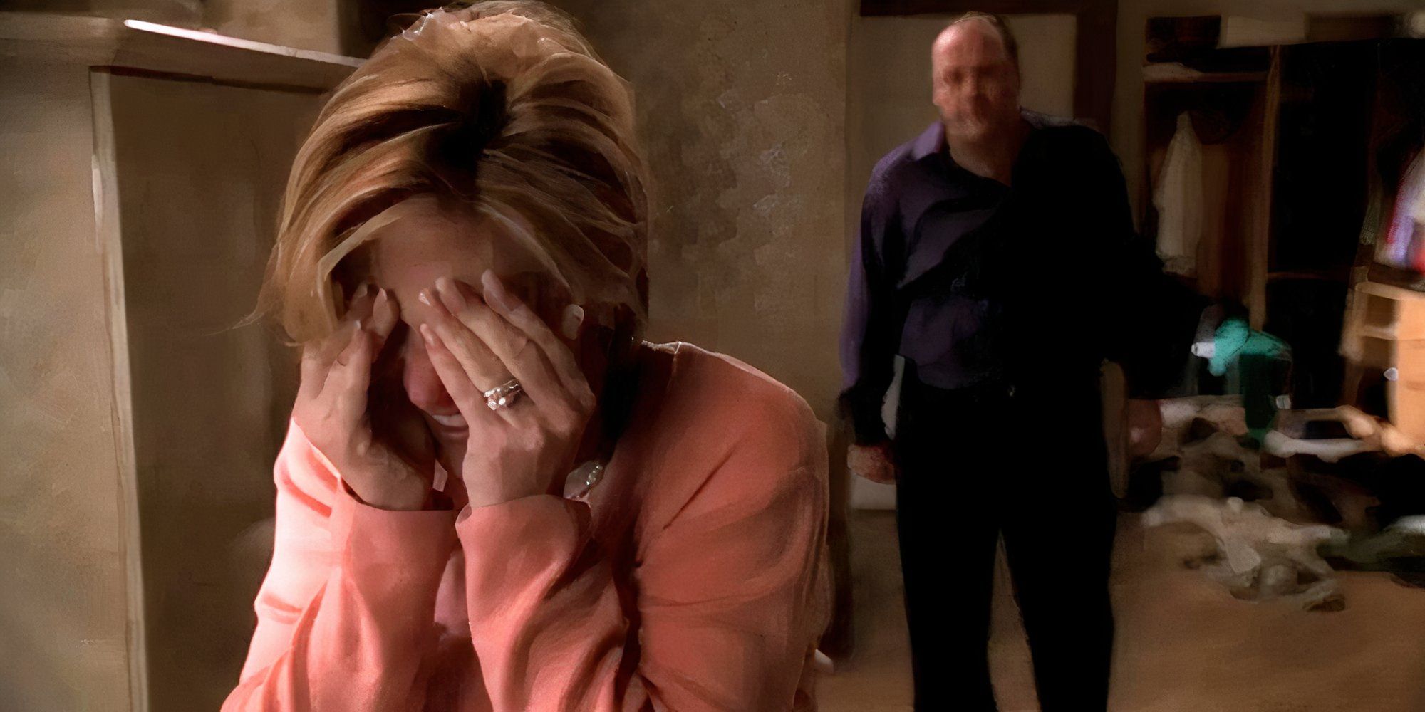 Edie Falco crying with her hands over face while James Gandolfini is standing in the background behind her inThe Sopranos S4E13 Whitecaps